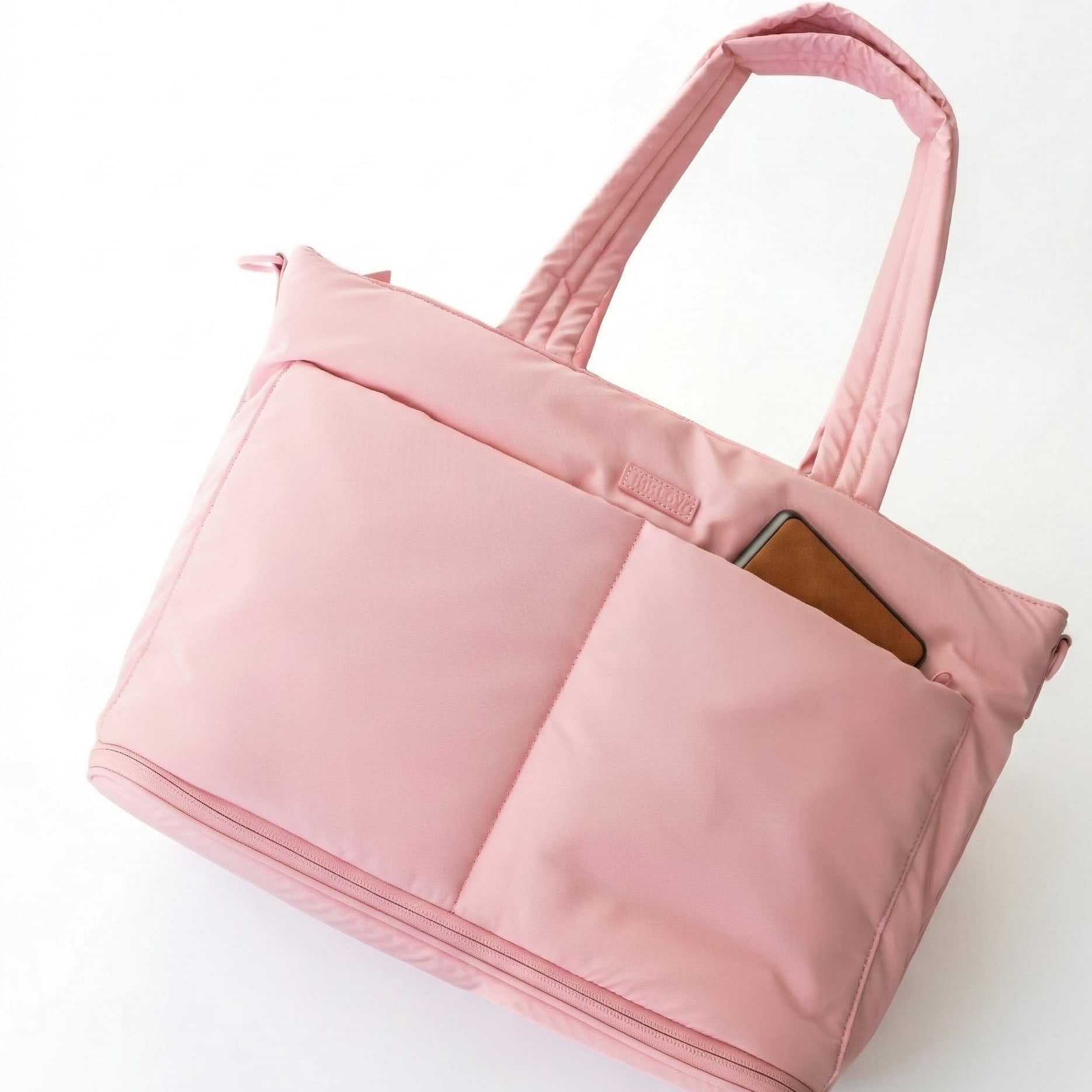 Pink tote bag with a pocket on a white background